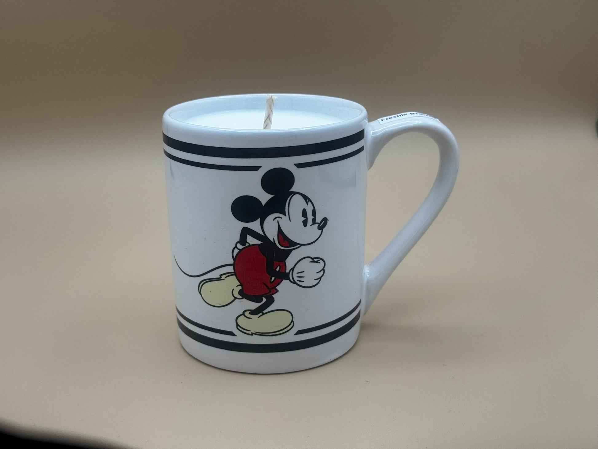 Mug with a cartoon character design on a plain background