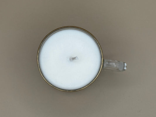 Top view Candle in a glass mug with a logo on a plain background